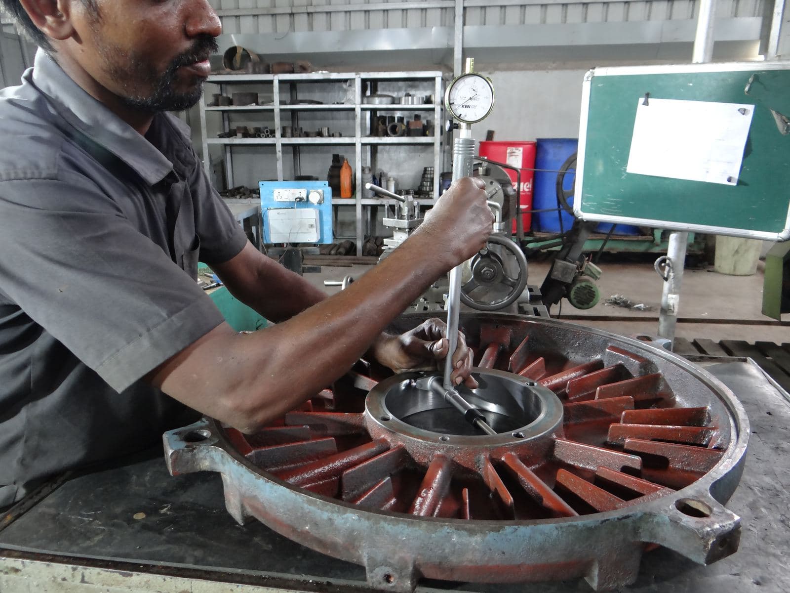 Bearing housing being measured using a bore dial gauge